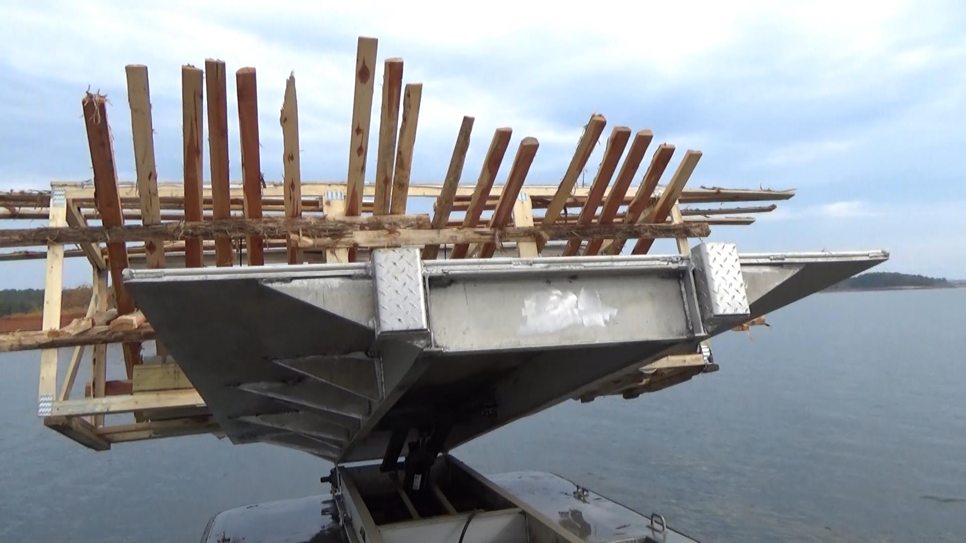 unload-skidoo crates-fish-structures-greers-ferry-lake-walleye-club