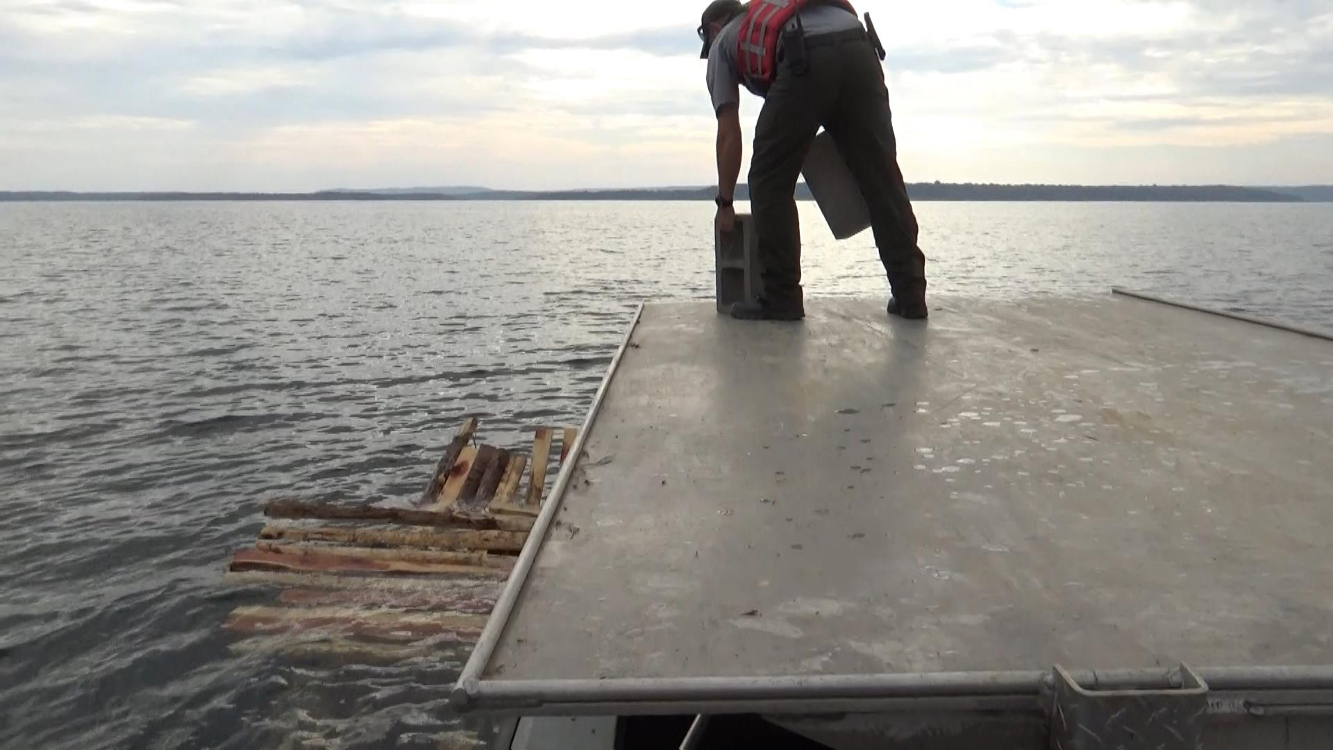 dumping-blocks-to sink-skidoo crates-fish-structures-greers-ferry-lake-walleye-club